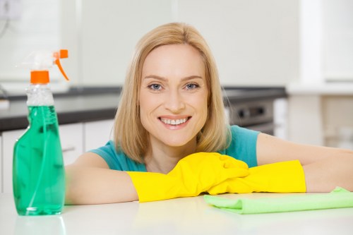 Cleaner preparing a carpeted hallway in Manor Park for deep cleaning
